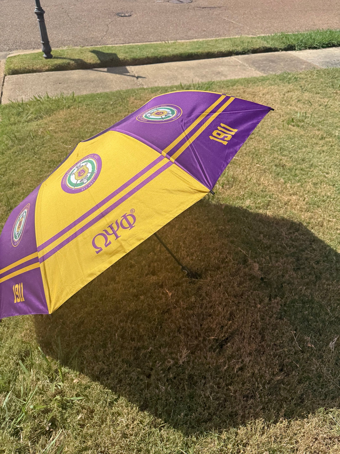 Omega Psi Phi purple and gold umbrella, side view