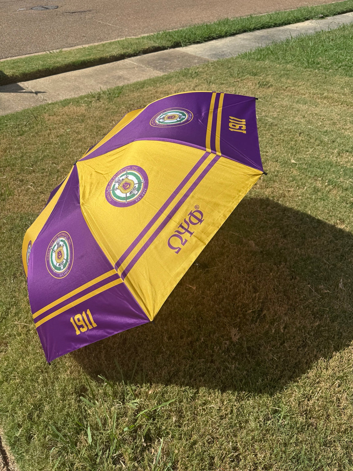 Omega Psi Phi purple and gold umbrella, side view